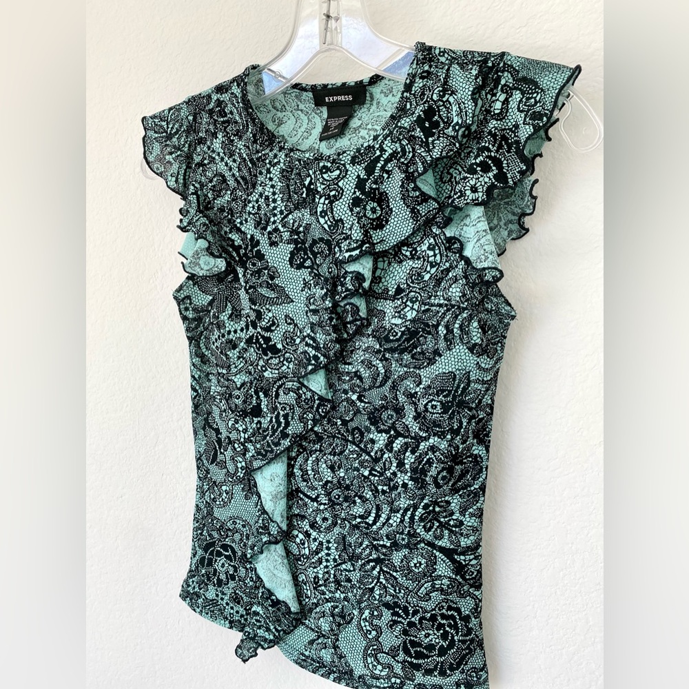 Teen’s net pattern knit top with feminine flutter sleeves and front.